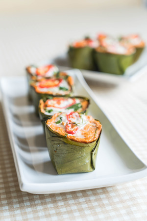 thai steamed curried fish on the tableの写真素材