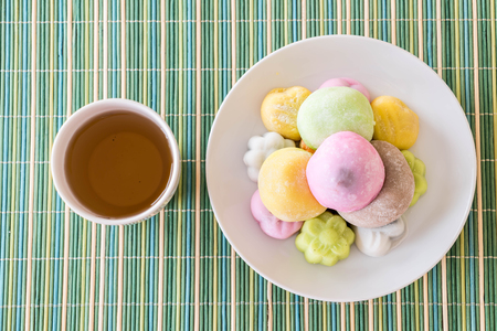 colorful dessert mochi on white plateの写真素材