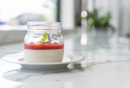 homemade dessert panna cotta with strawberry sauceの写真素材