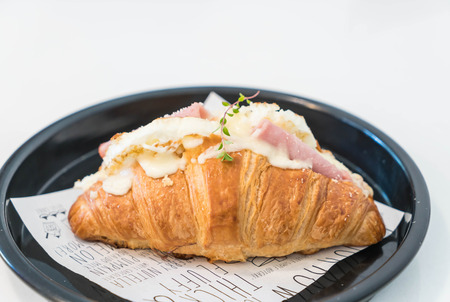 croissant ham cheese on plateの写真素材