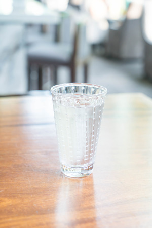 glass of water on the tableの写真素材