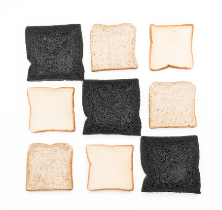 charcoal, milk and whole wheat bread on white backgroundの写真素材