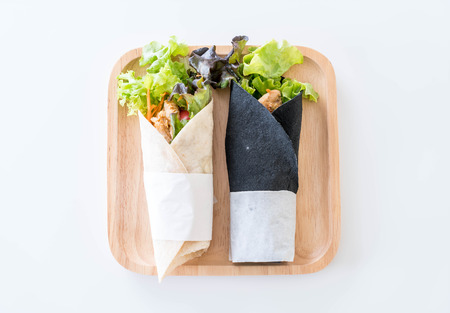 wrap salad roll on the tableの写真素材