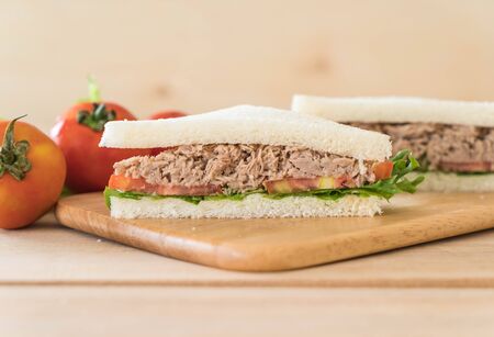 tuna sandwich on wood boardの写真素材