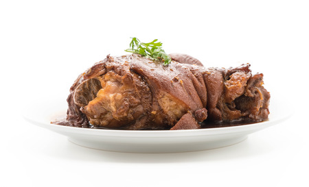 Stewed pork leg in gravy soup on white backgroundの写真素材