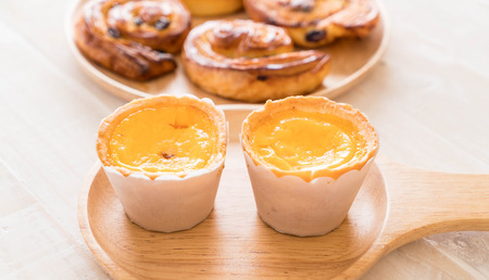 egg tart on wood plate