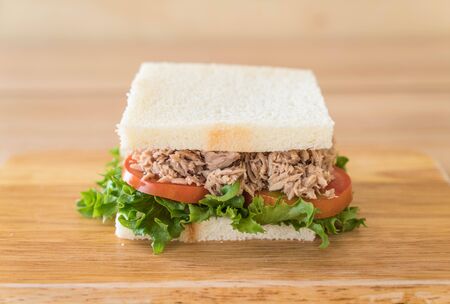 tuna sandwich on wood boardの写真素材