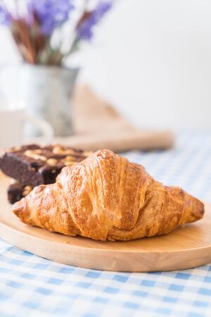 croissant and brownies on tableの写真素材