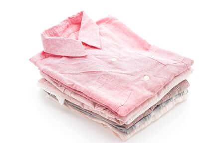 stacks of clothing on white backgroundの写真素材