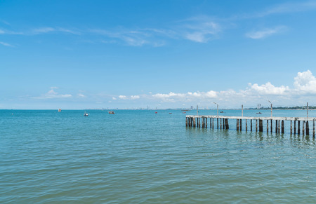 Wooden walking way on the beach leading to the sea natural landscape backgroundの写真素材