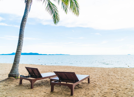Beach chair, Palm and tropical beach at Pattaya in Thailand - boost up color and lighting processing styleの写真素材