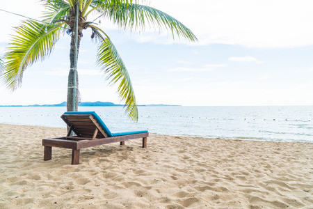 Beach chair, Palm and tropical beach at Pattaya in Thailand - boost up color and lighting processing styleの写真素材