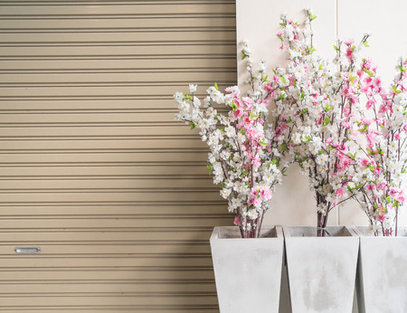 plastic sakura in vase with copy spaceの写真素材