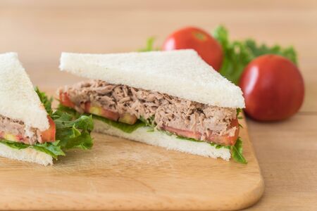 tuna sandwich on wood boardの写真素材
