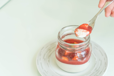 homemade dessert panna cotta with strawberry sauceの写真素材