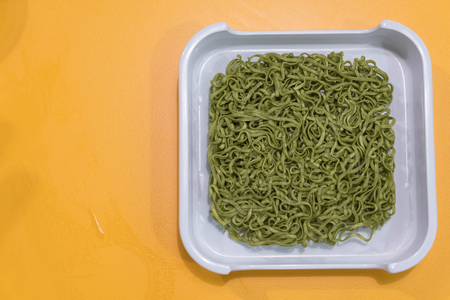 Jade noodles or green noodle on white plateの写真素材