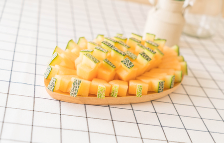 fresh cantaloupe melon for dessert on tableの写真素材