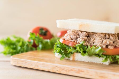 tuna sandwich on wood boardの写真素材
