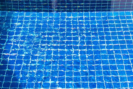 Blue ripped water in swimming poolの写真素材
