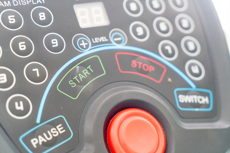 close-up button on exercise machineの写真素材