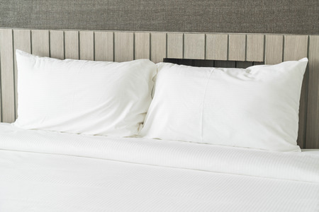 White pillow on bed decoration in bedroom interior