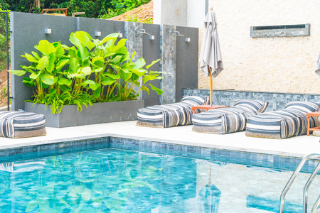 Beautiful luxury umbrella and chair around outdoor swimming pool in hotel and resortのeditorial素材