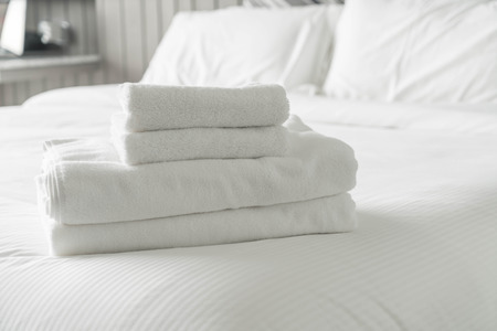 White towel on bed decoration in bedroom interior - Vintage light Filterの写真素材