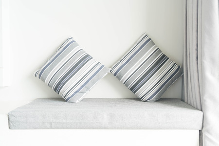 Beautiful pillow on sofa decoration in living room interiorの写真素材