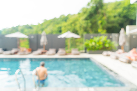 Abstract blur swimming pool in hotel resort for background