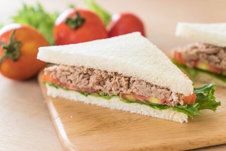 tuna sandwich on wood boardの写真素材