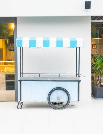 empty pushcart for selling  with cafe backgroundの写真素材