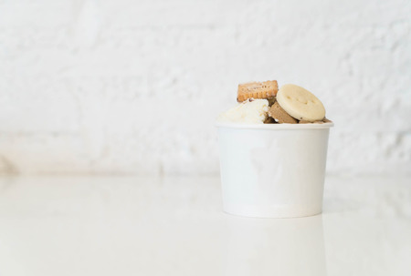 homemade ice-cream in cup with biscuitの写真素材