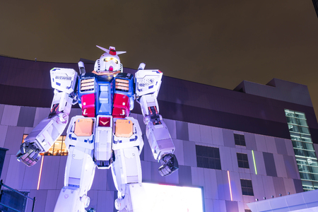 ODAIBA, JAPAN - NOVEMBER 16, 2016: statue of gundum in front of the shopping mall in Odaiba at nightのeditorial素材