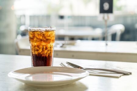 iced cola glass on the tableの写真素材