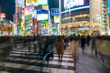 Tokyo, Japan, Nov 17, 2016: Shibuya Crossing Of City street with crowd people on zebra crosswalk in Shibuya town. Shibuya is a special ward located in Tokyo for shopping at night.