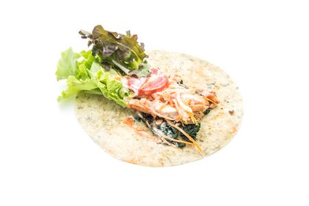 wrap salad roll with chicken and spinach on white backgroundの写真素材