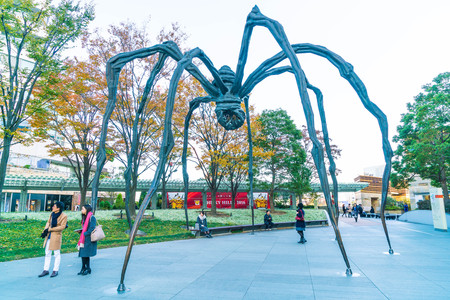 TOKYO, JAPAN - NOVEMBER 18 2016 : Maman - a spider sculpture by Louise Bourgeois, situated at the base of Mori tower building in Roppongi Hills, Tokyo Japanのeditorial素材