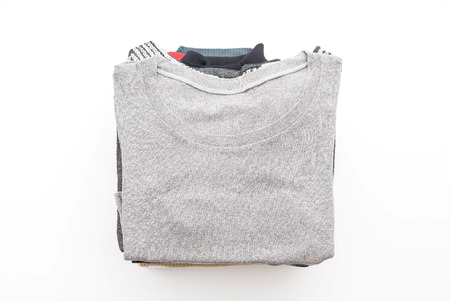 stacks of clothing on white backgroundの写真素材