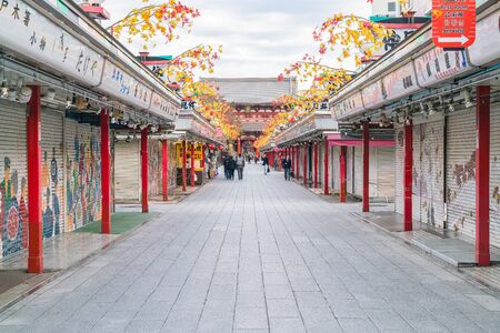 Toyko, Japan - 16 November 2016: Tourists walk on Nakamise Dori in Sensoji shrine. Sensoji temple -...