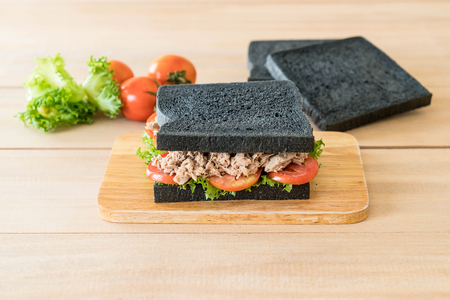 tuna charcoal  sandwich on wood boardの写真素材