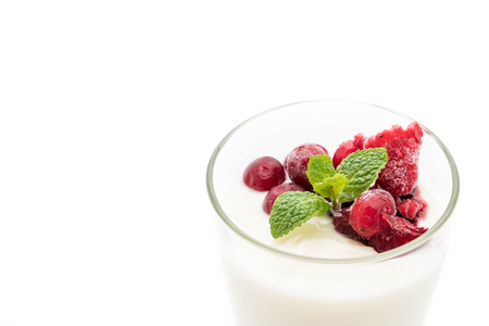 yogurt with mixed berries on white backgroundの写真素材
