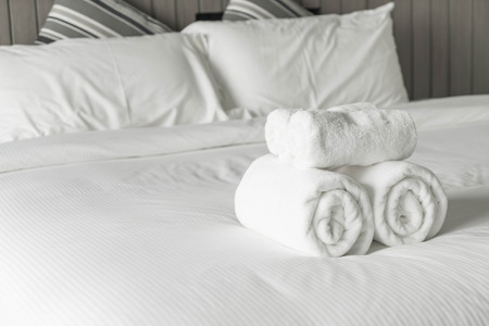 White towel on bed decoration in bedroom interior - Vintage light Filterの写真素材