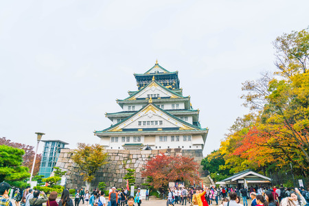 OSAKA, JAPAN - NOV 20 : Visitors crowded at Osaka Castle Park. It is a public urban park and historical site situated at Osaka, Japan.のeditorial素材