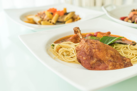 spicy penne with fried duck - fushion foodの写真素材