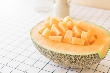 fresh cantaloupe melon for dessert on tableの写真素材
