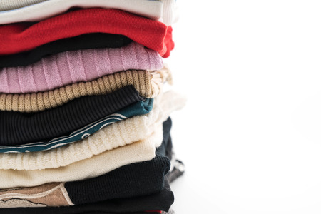 stacks of clothing on white backgroundの写真素材