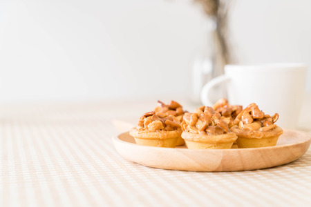 toffee cupcake with coffee on the tableの写真素材