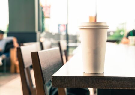hot coffee cup in coffee shop - vintage effect filter