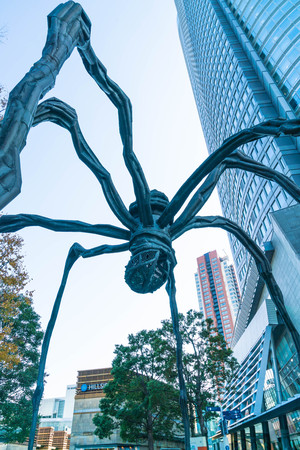 TOKYO, JAPAN - NOVEMBER 18 2016 : Maman - a spider sculpture by Louise Bourgeois, situated at the base of Mori tower building in Roppongi Hills, Tokyo Japanのeditorial素材
