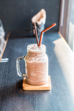 Chocolate smoothie (milkshake) with jar in cafeの写真素材